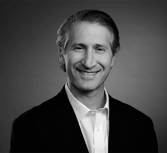 Black and white headshot of Kevin Brounstein