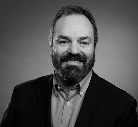 Black and white headshot of Patrick Stevens