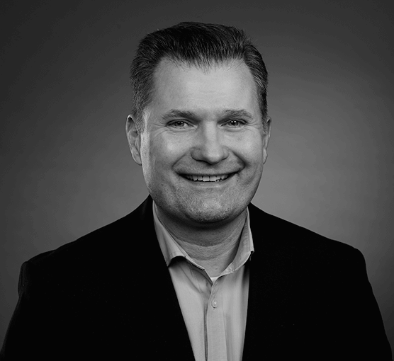 Black and white headshot of Peter Nowakowski