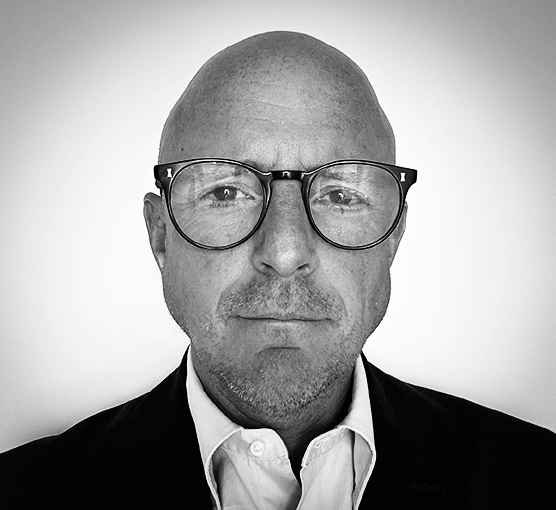Black and white headshot image of Paul Higginbottom
